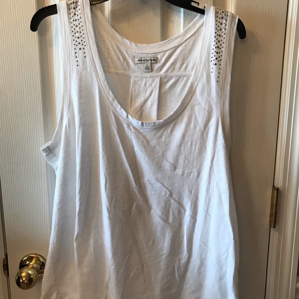White tank with metal studs